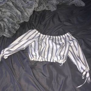 I’m selling a black and white striped cropped top.